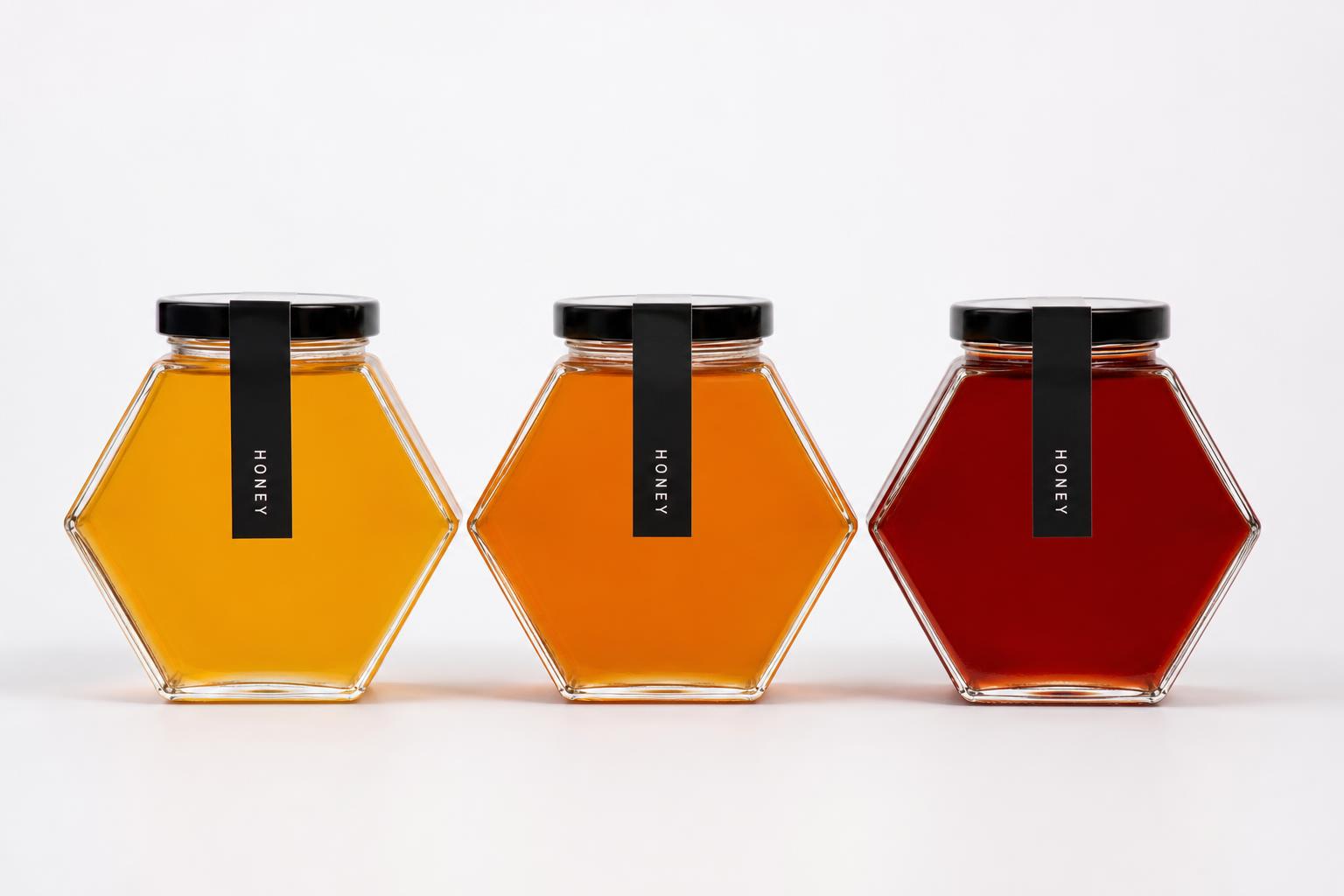 Hexagonal honey jars in three shades